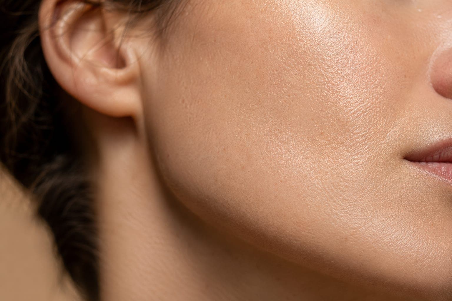 Close-up macro photograph of healthy skin texture showing natural luminosity and density that results from proper collagen synthesis